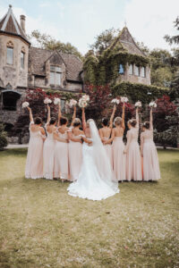 Bridal party outside of castle 200x300