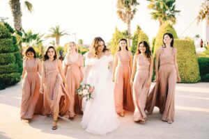 free photo of bride and the bridesmaids in light pink dresses 300x200