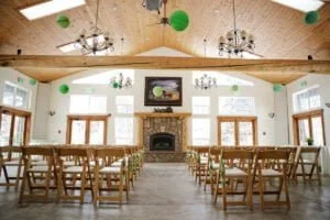 indoor wedding ceremony at meadow creek lodge event center in colorado orig 300x200