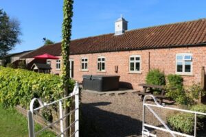 Picture 6 clock tower and hot tub 600x400 1 300x200