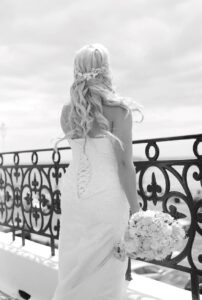 Bride on bridal suite balcony no trim 202x300
